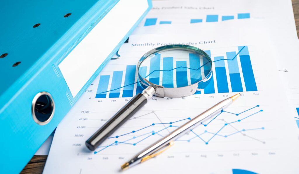Home 18 Scalable testing concept shown with graphs, charts, and magnifying glass for analysis.